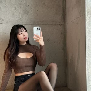 Visualprompt.org a knit top with a chest cut out and black denim shorts. ab7d00ecd6