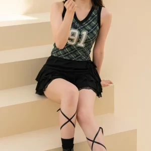 Visualprompt.org green checkered sleeveless top and a black ruffled mini skirt 02d5978458