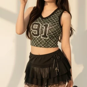 Visualprompt.org green checkered sleeveless top and a black ruffled mini skirt c5f424e026