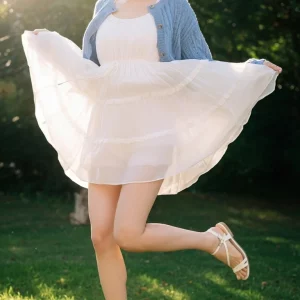 Visualprompt.org snapshot of a model in a chiffon one piece dress at a park 61707f9cc9