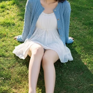 Visualprompt.org snapshot of a model in a chiffon one piece dress at a park 6a0c80206e