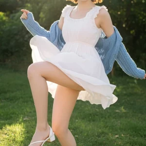 Visualprompt.org snapshot of a model in a chiffon one piece dress at a park 81375dab12