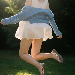 Visualprompt.org snapshot of a model in a chiffon one piece dress at a park 8832d113d6