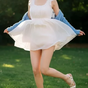 Visualprompt.org snapshot of a model in a chiffon one piece dress at a park e373175bc0