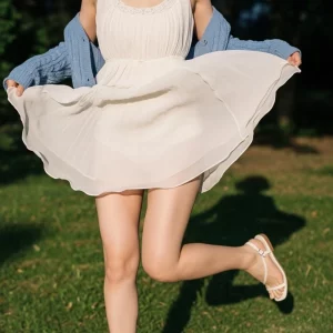 Visualprompt.org snapshot of a model in a chiffon one piece dress at a park fc8e150cd1